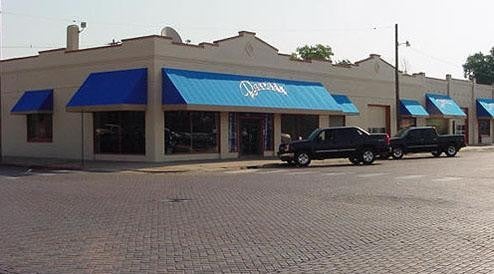 Two Cars Near By Showroom Image